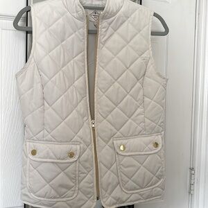 White quilted vest with gold accents